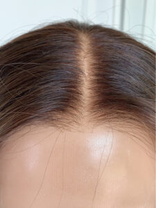 Close-up of a lace top wig parting